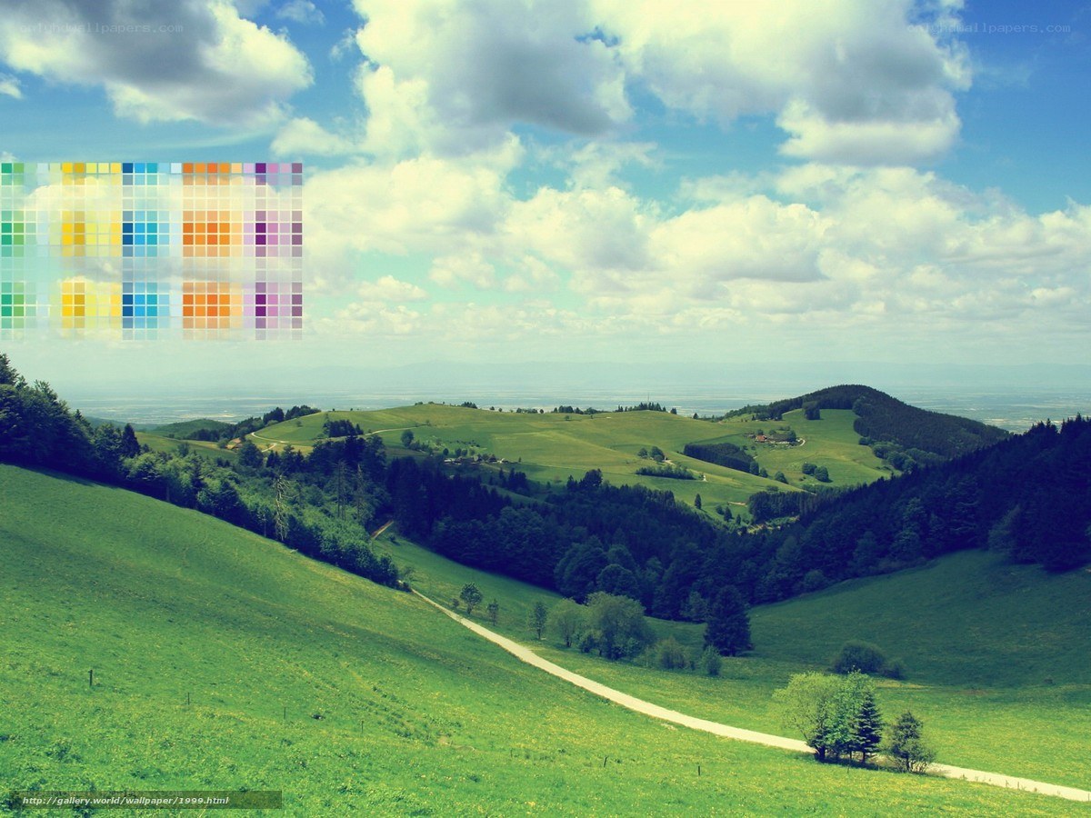 Green hills under cloudy sky
