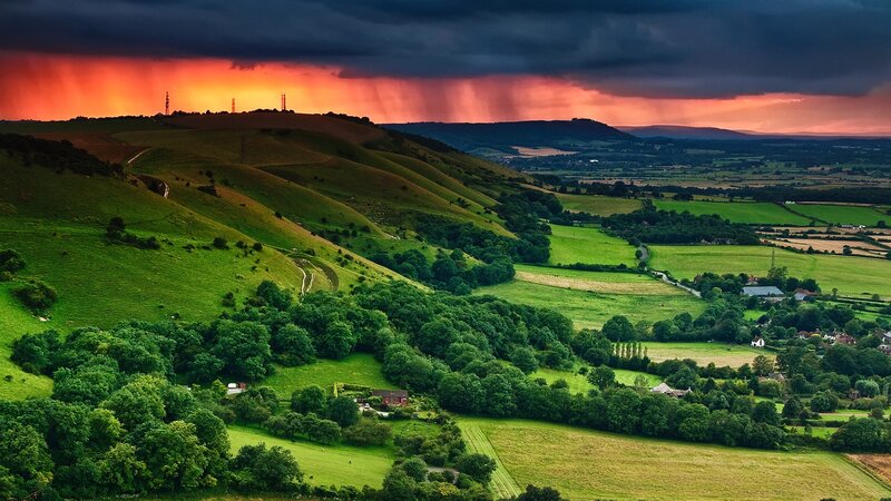Green Hills under Stormy Sky — Dramatic, Sunset, Photograph