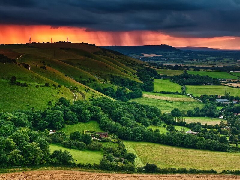 Green Hills under Stormy Sky — Dramatic, Sunset
