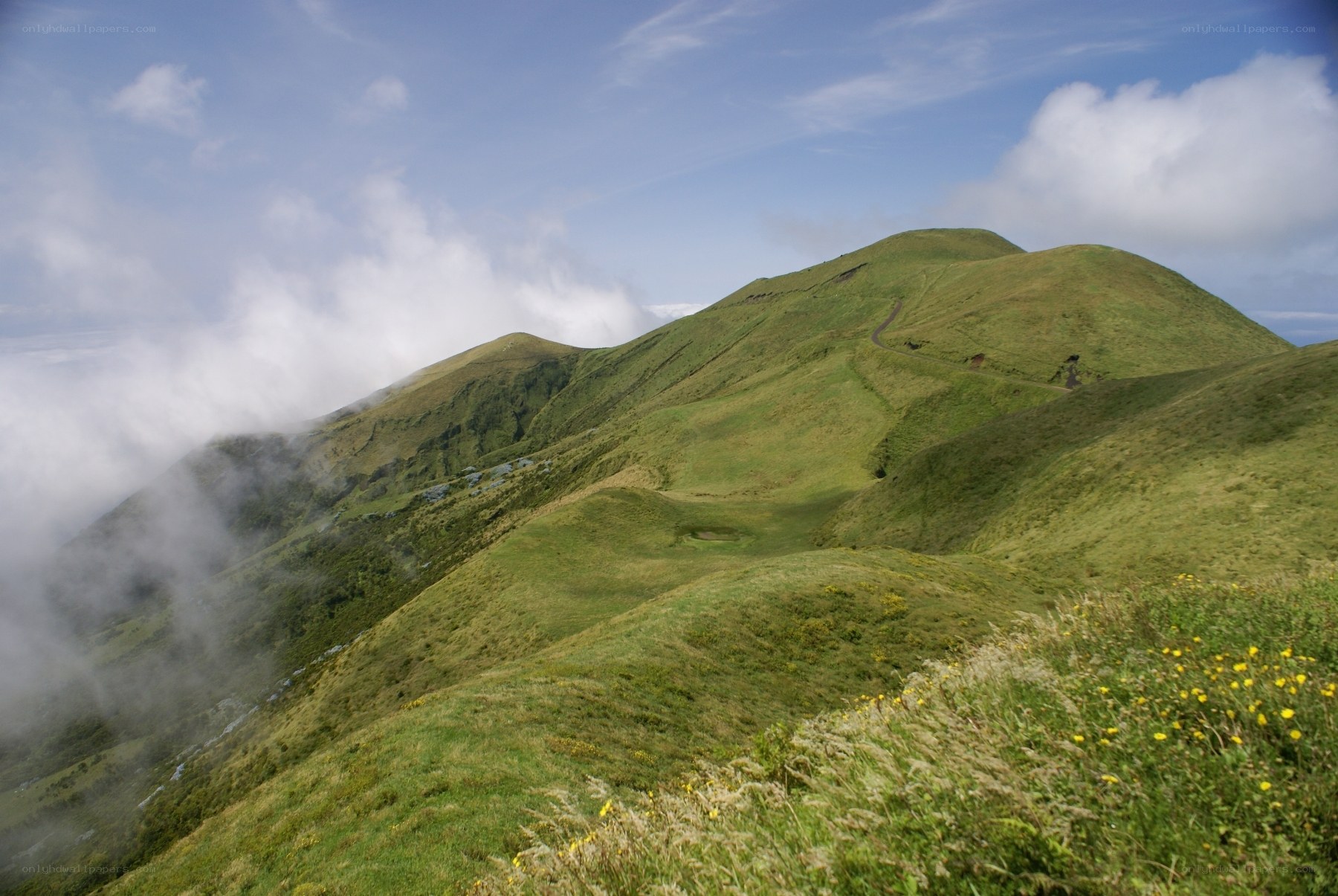 Green hills with clouds