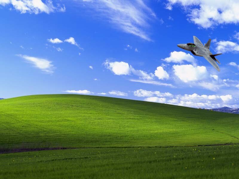 Green hills with fighter jet