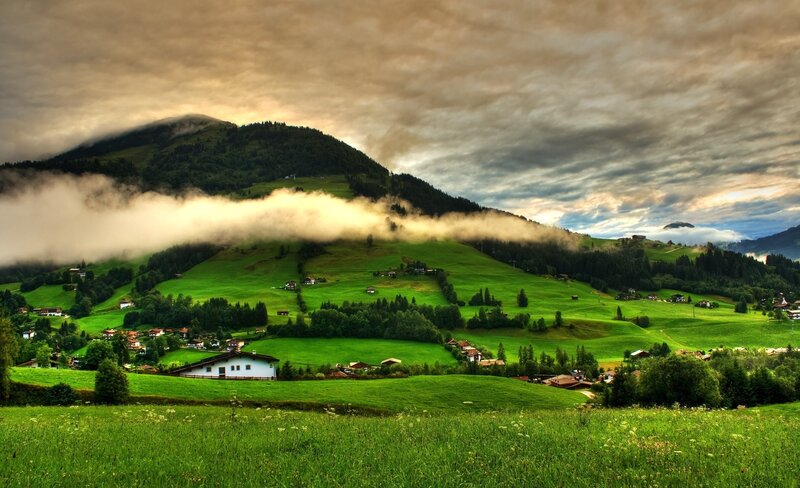 Green hills with misty mountains