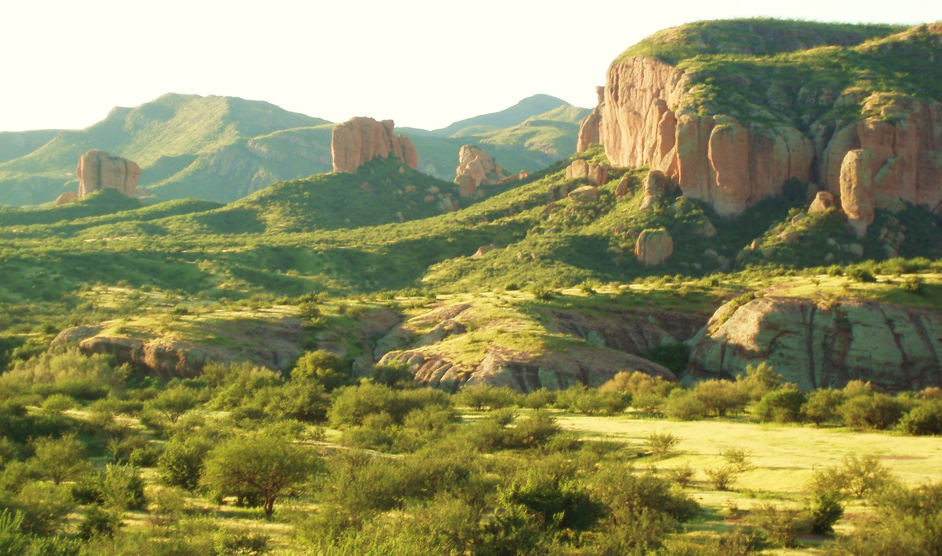 green hills with rock formations
