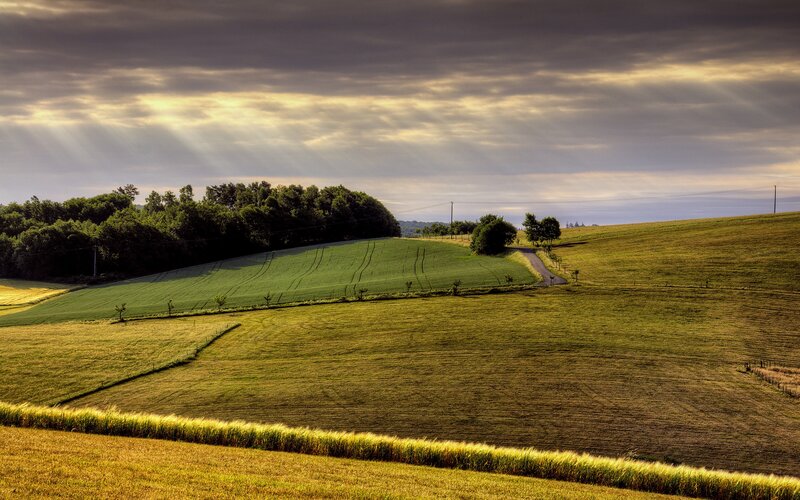 Green Hills with Sunbeams — Dramatic