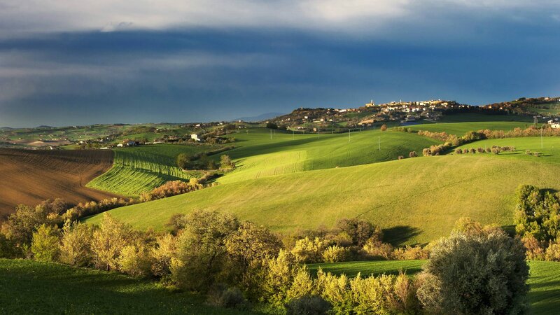 Green Hills with Village — Dramatic