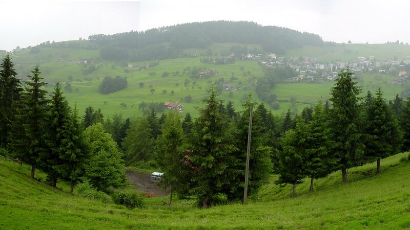 green hills with village view