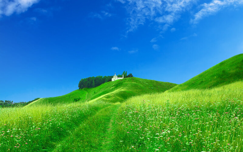 Green hills with white church