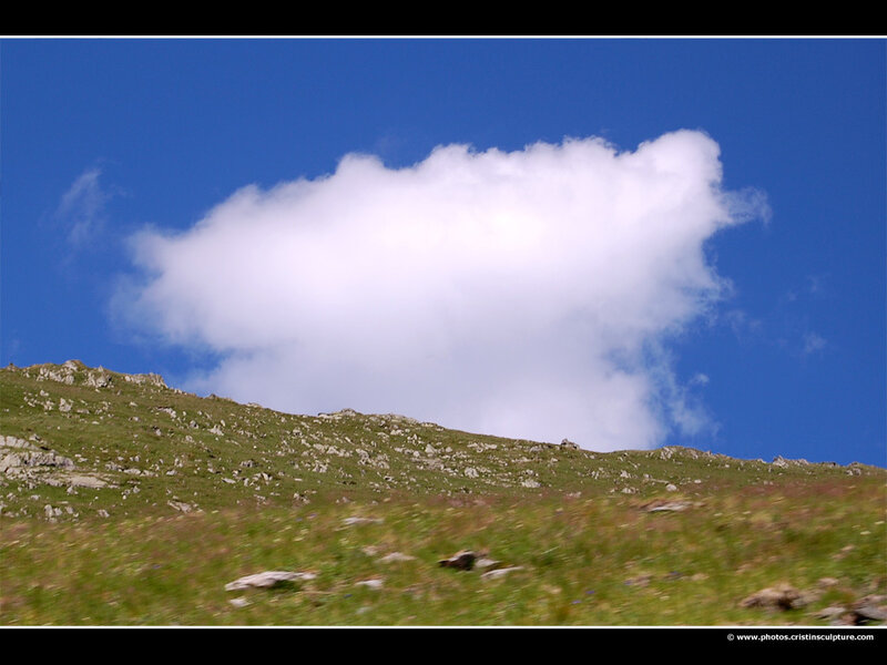 Green Hillside with Cloud