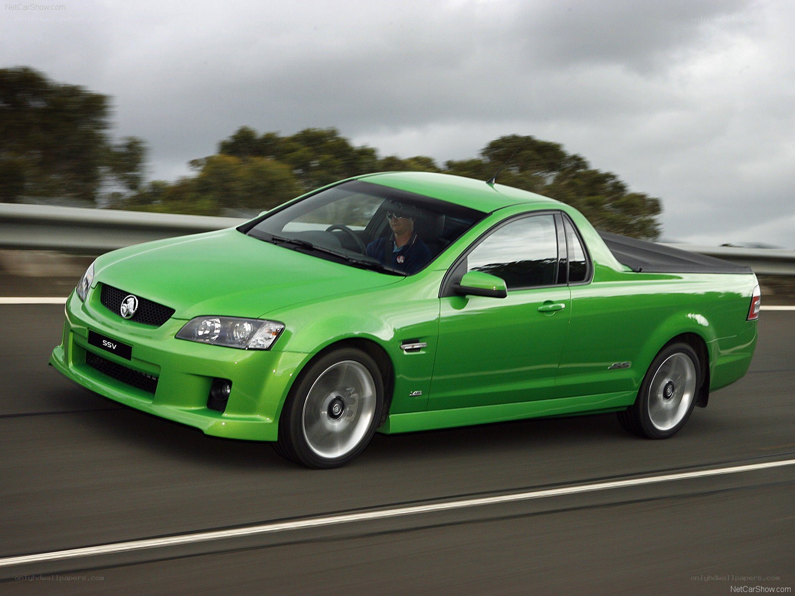 green Holden utility in motion