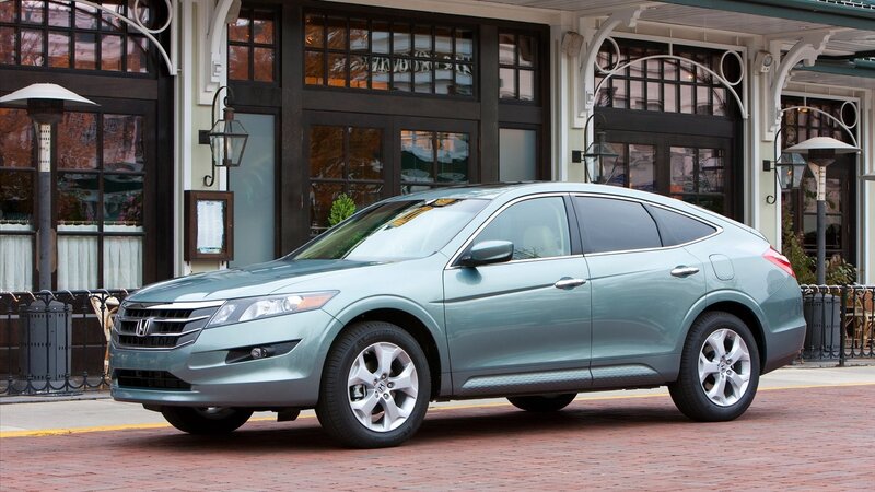 Green Honda Crosstour parked on street