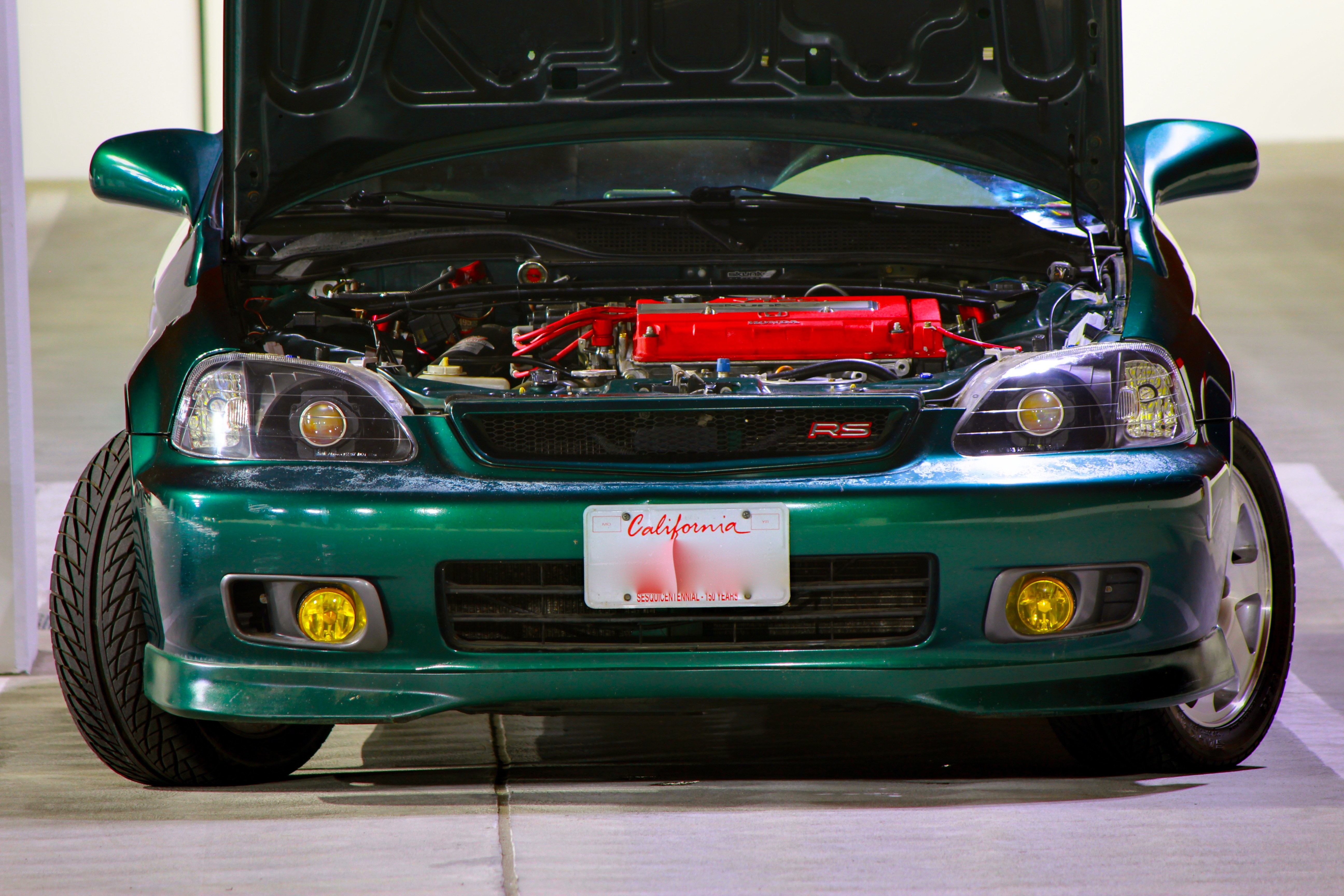 green honda with open hood
