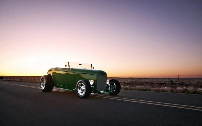 green hot rod on desert road