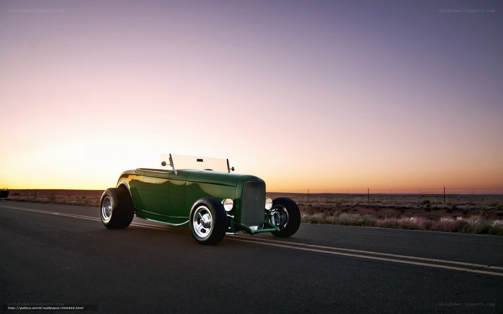 Green hot rod on desert road