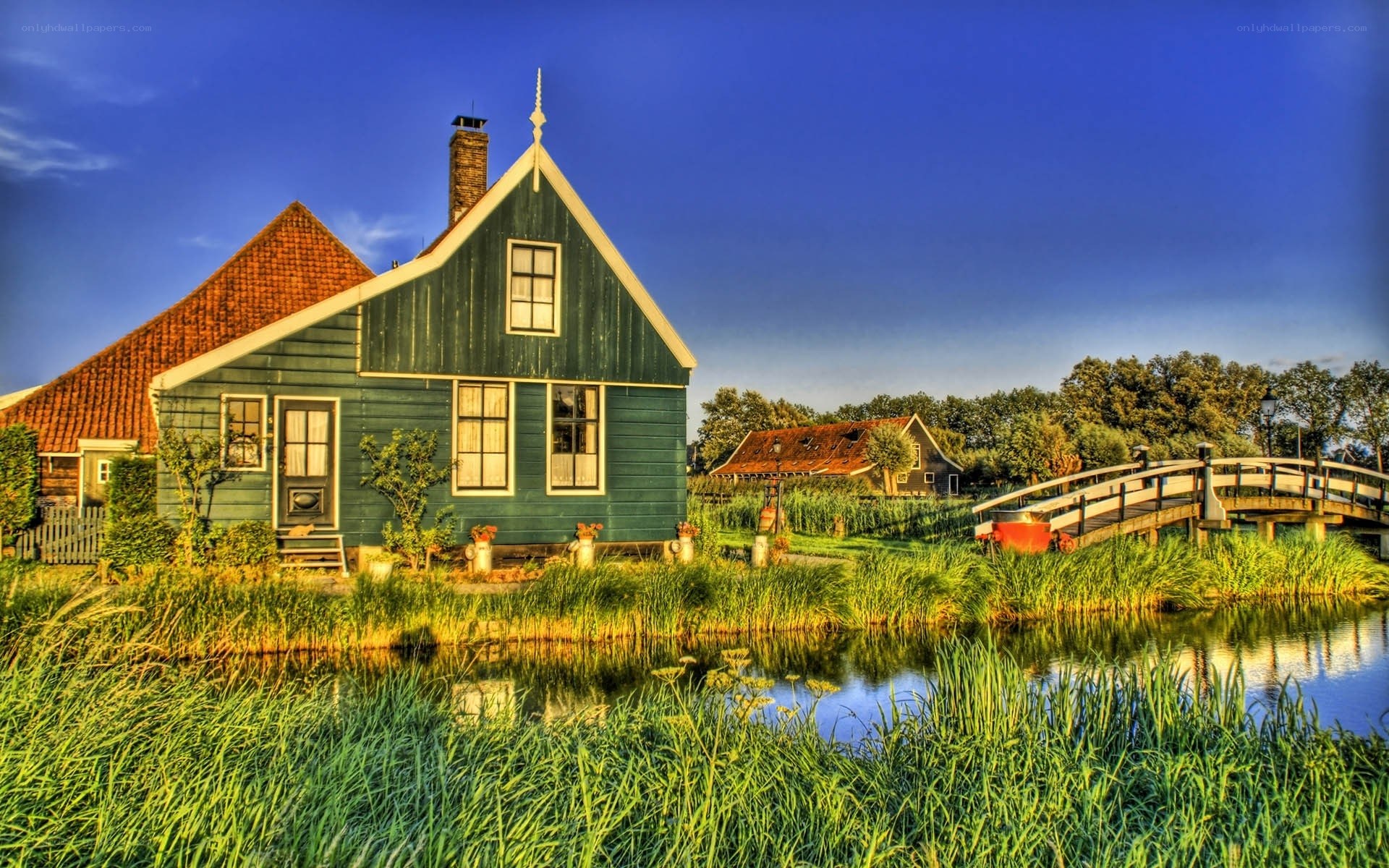Green house by a canal