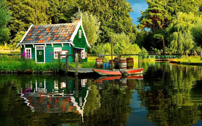 Green Houseboat on Canal — Serene, Afternoon, Photograph