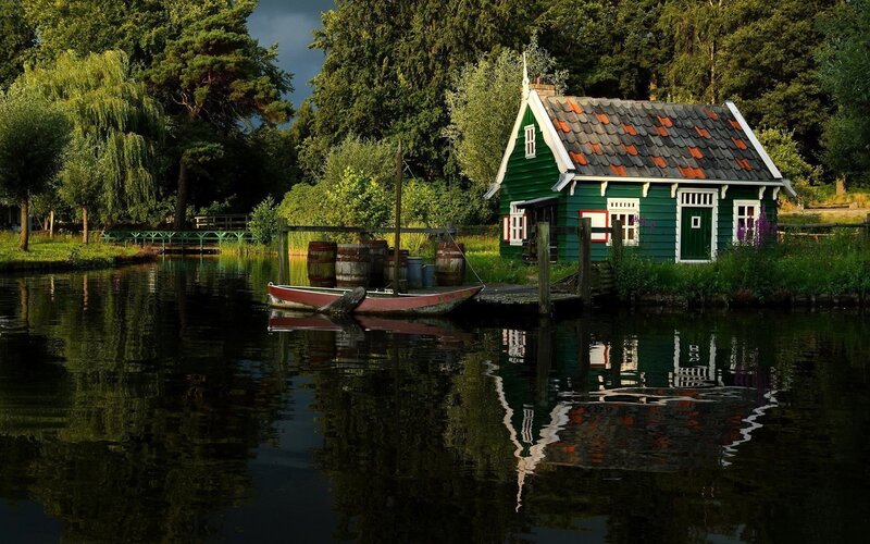 Green Houseboat on Canal — Serene, Afternoon, Photograph, Trees
