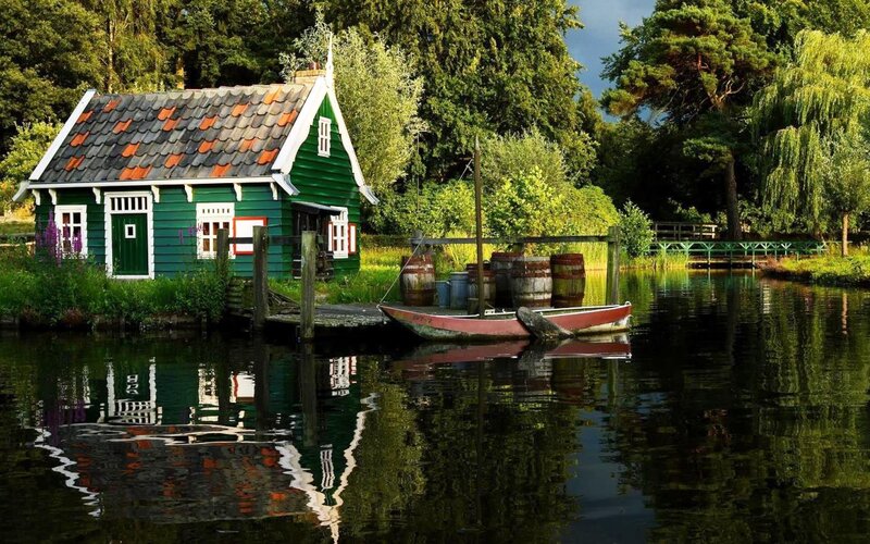 Green Houseboat on Canal — Serene
