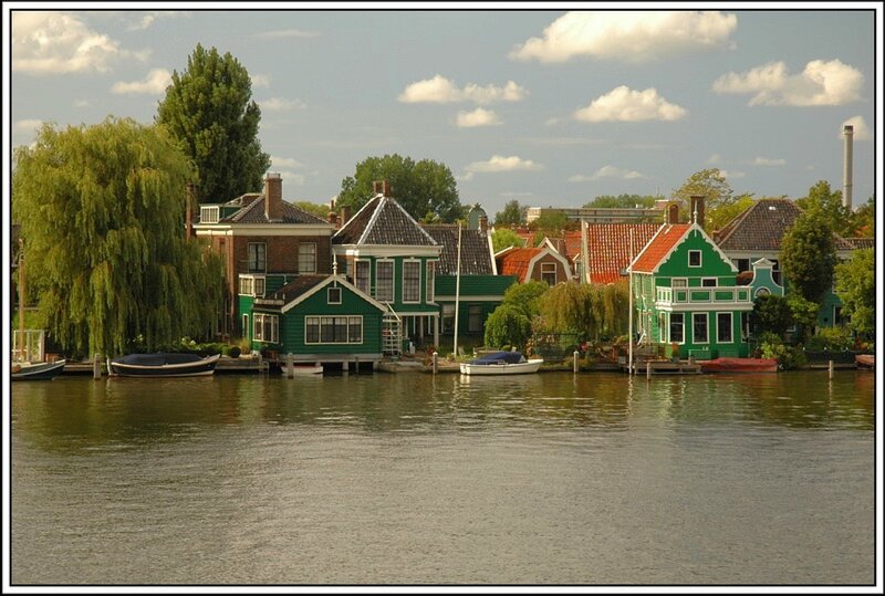 Green houses along a canal