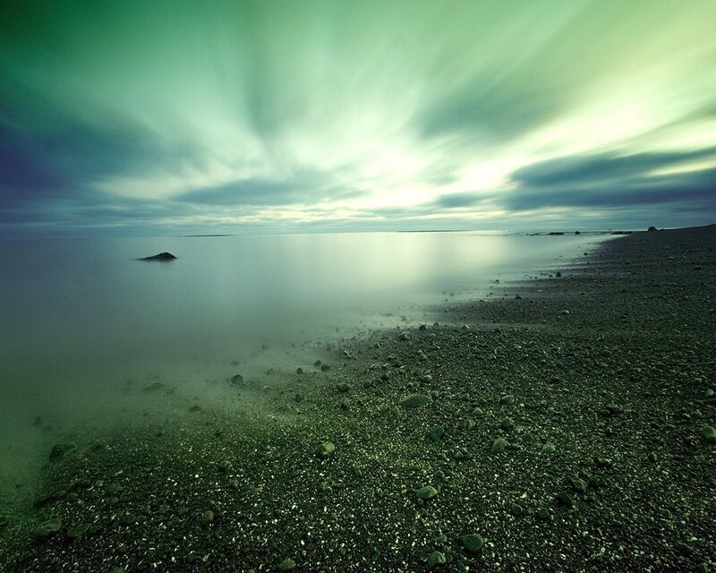 Green-hued coastal landscape