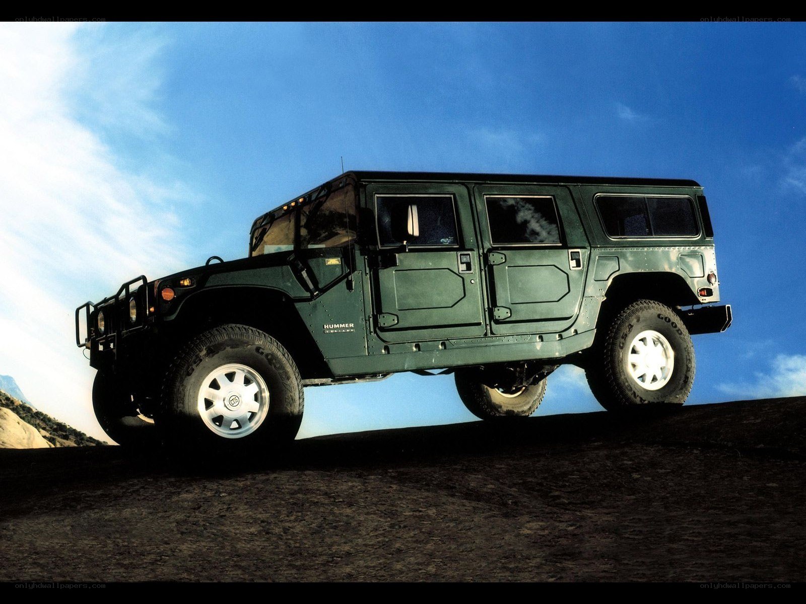 Green Hummer on a hill