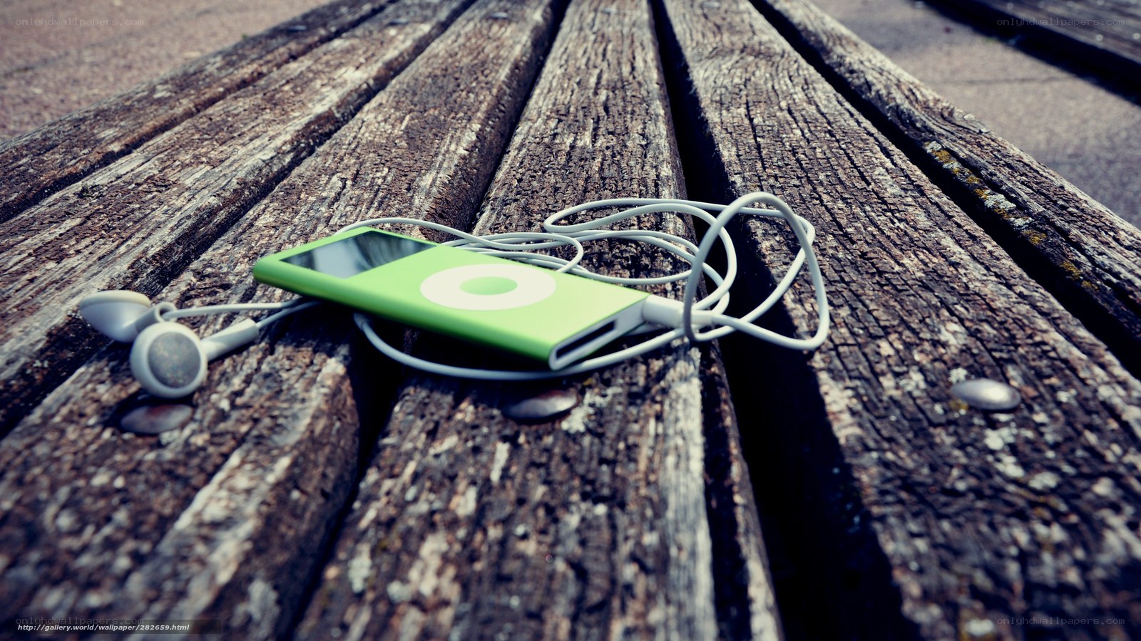 Green iPod on wooden bench