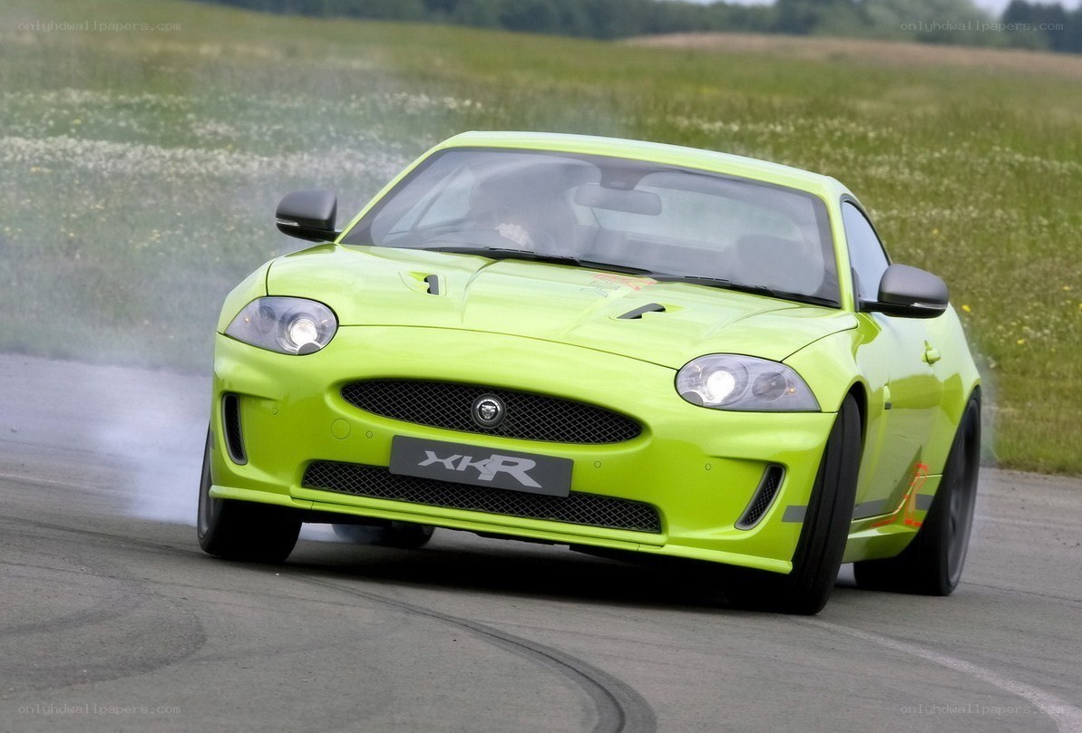 Green Jaguar XKR drifting