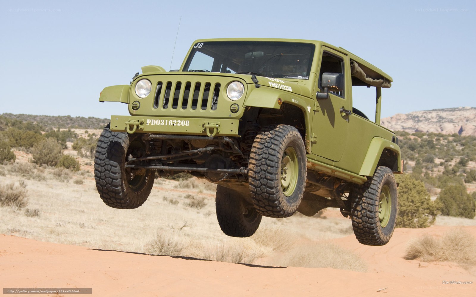 Green Jeep in Desert Jump