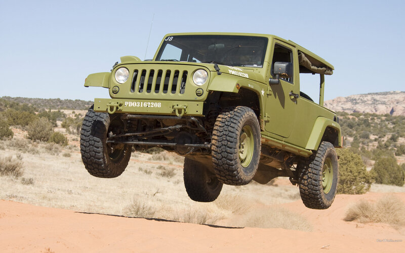 Green Jeep in Mid-air