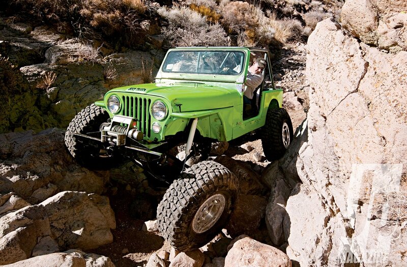 Green Jeep on Rocks