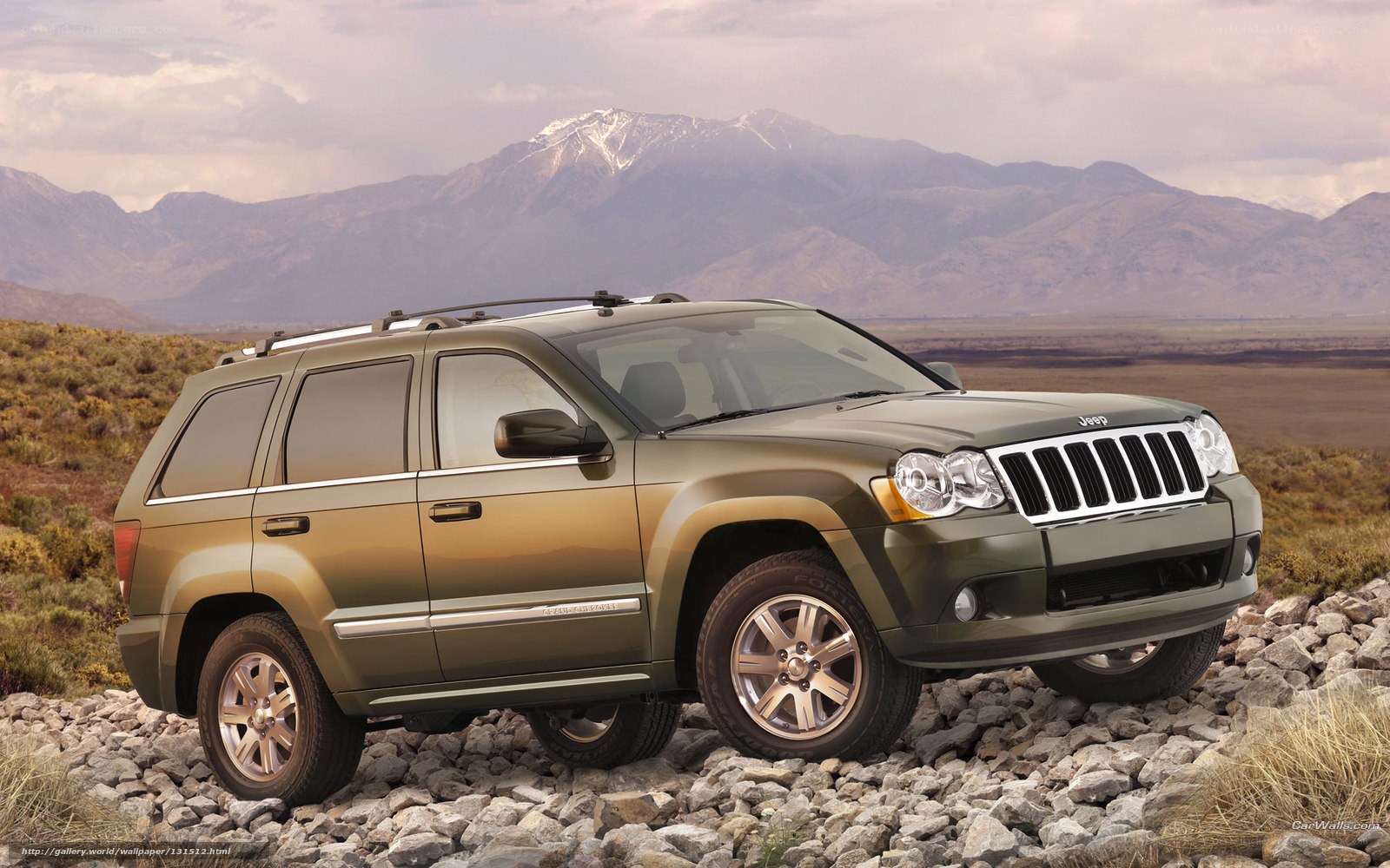Green Jeep on rocky terrain