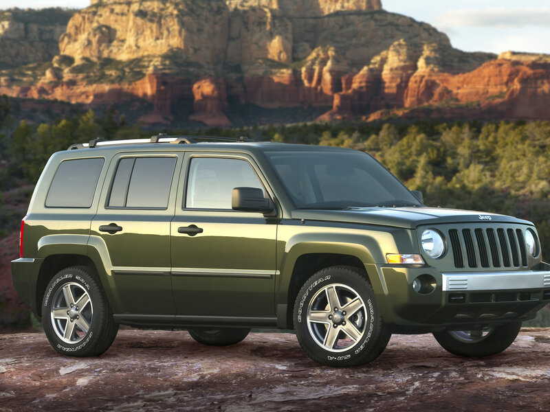 Green Jeep Patriot in desert