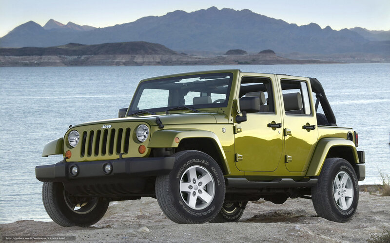 Green Jeep Wrangler by the lake