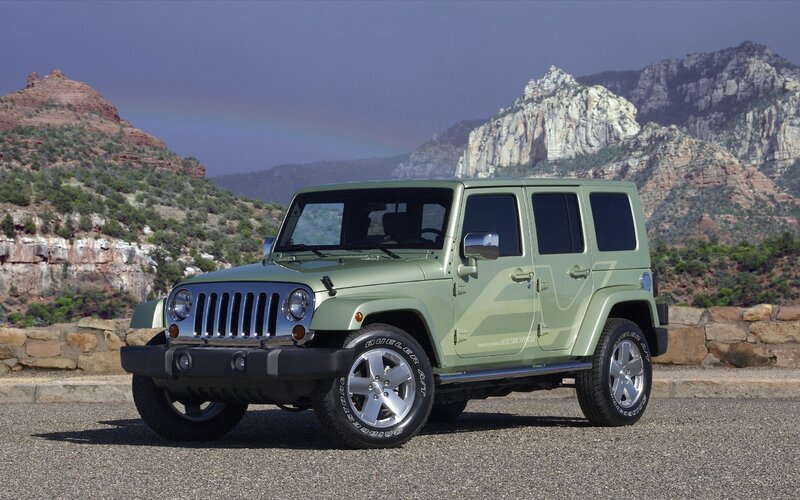 Green Jeep Wrangler in desert