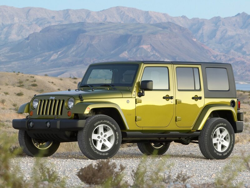 Green Jeep Wrangler in desert