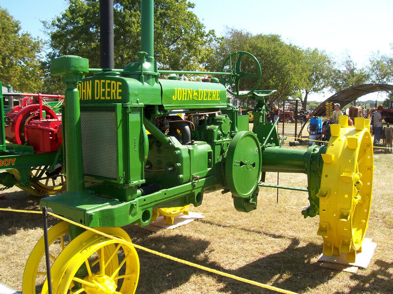 Green John Deere tractor on display
