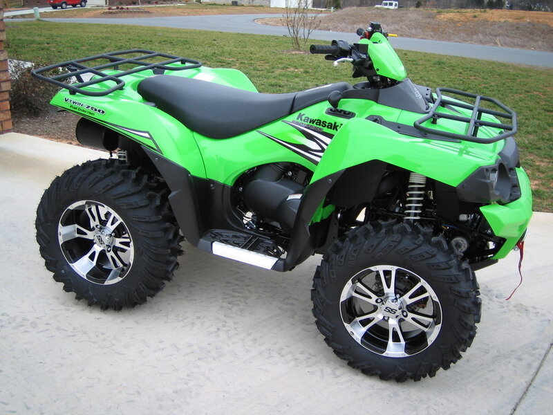 green kawasaki atv on driveway