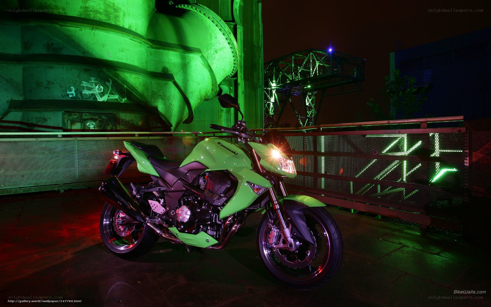 Green Kawasaki motorcycle at night