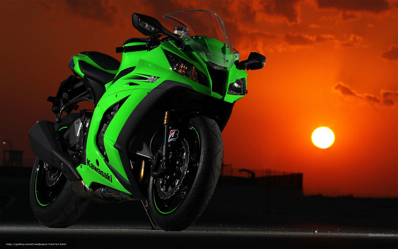 Green Kawasaki motorcycle at sunset