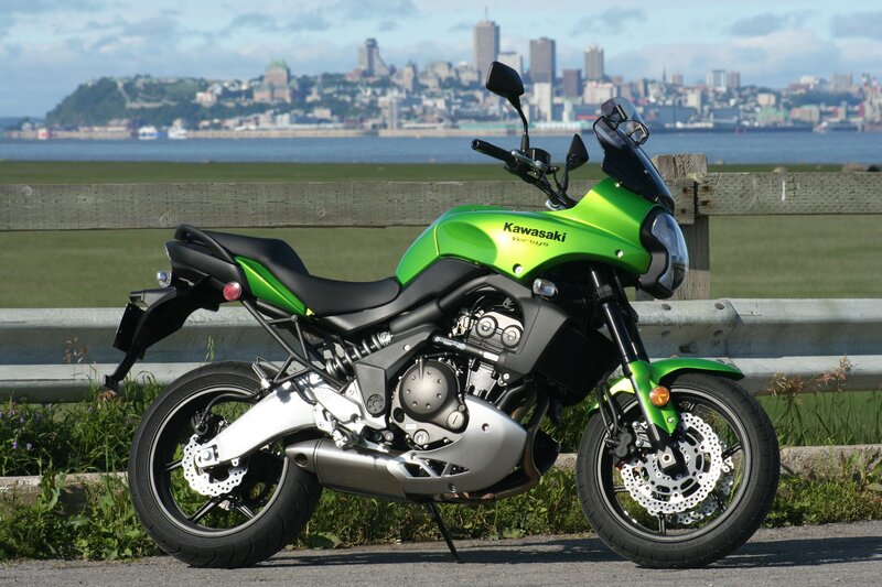 Green Kawasaki motorcycle by water