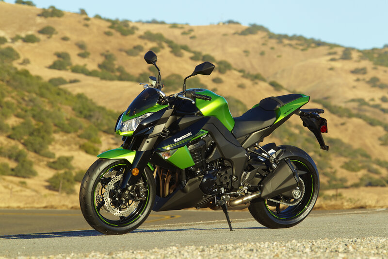 Green Kawasaki motorcycle on road