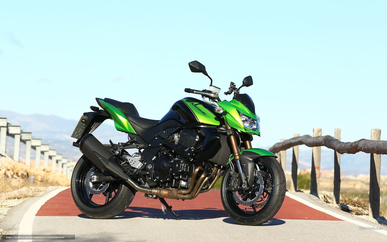 Green Kawasaki motorcycle on road