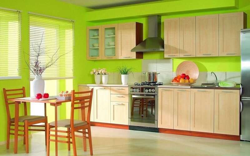 green kitchen with wooden furniture