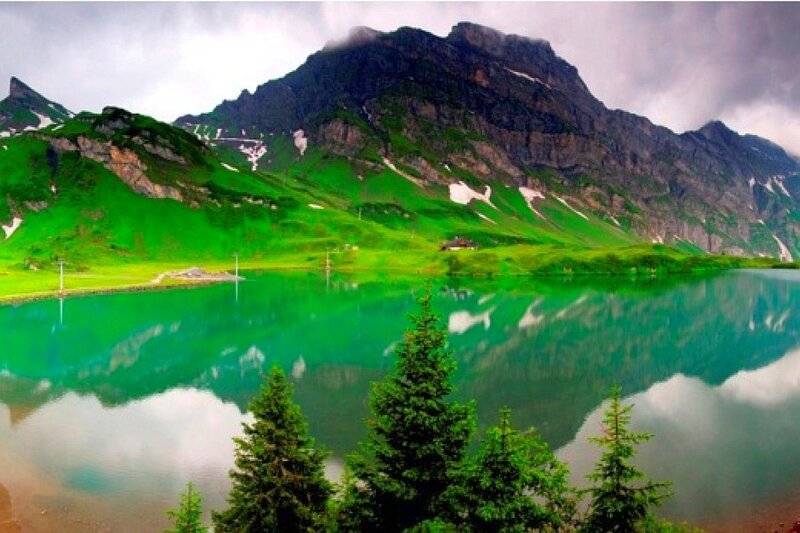 Green lake in mountain valley