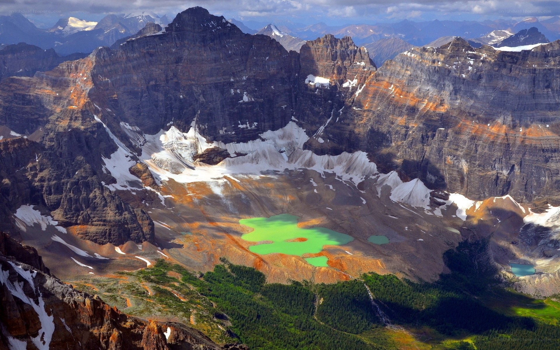 Green lake in mountain valley
