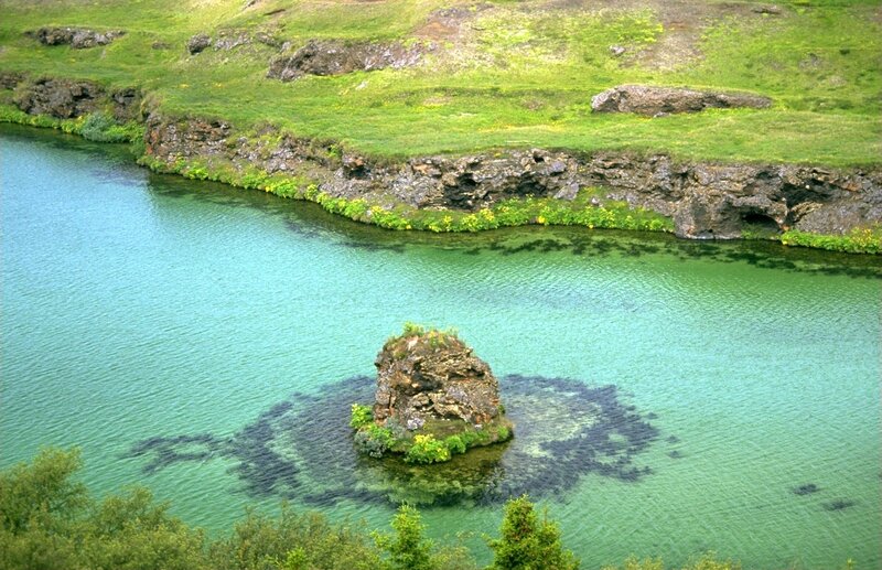 Green lake with rock island