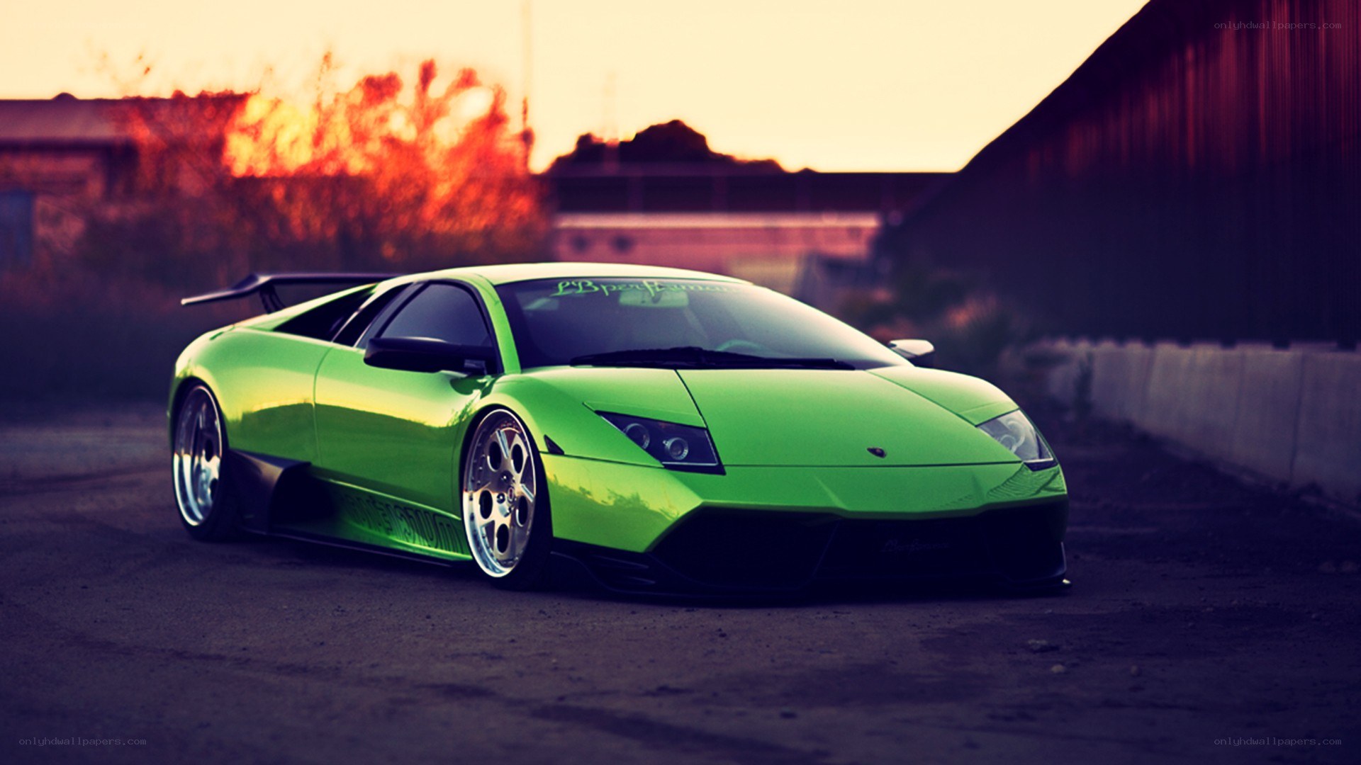 green lamborghini at sunset