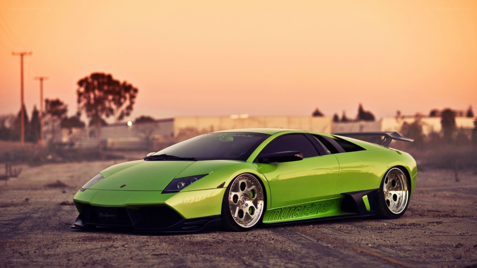 green lamborghini at sunset