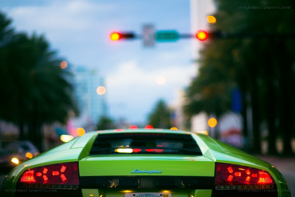green lamborghini at traffic light