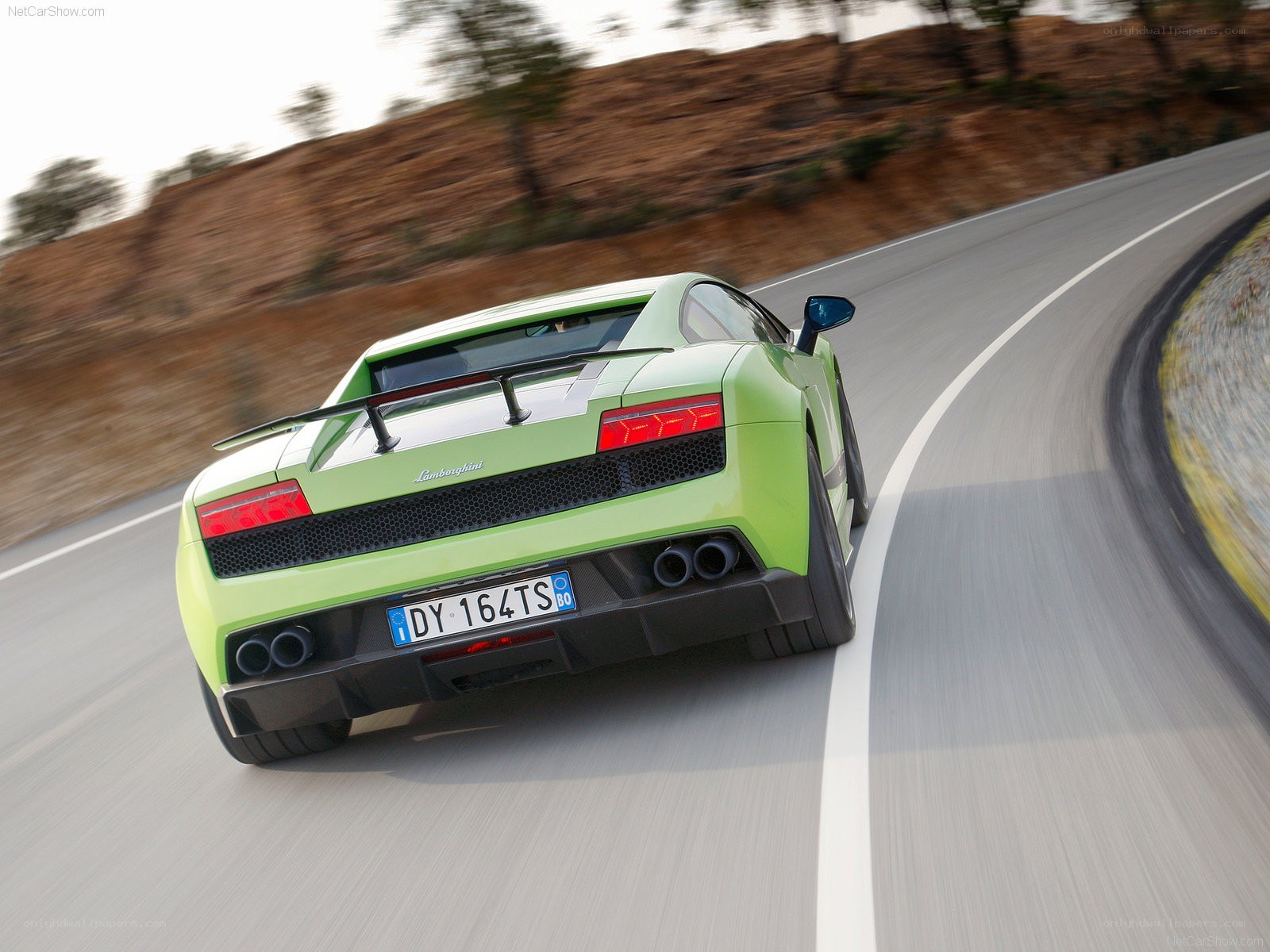 green lamborghini driving on road