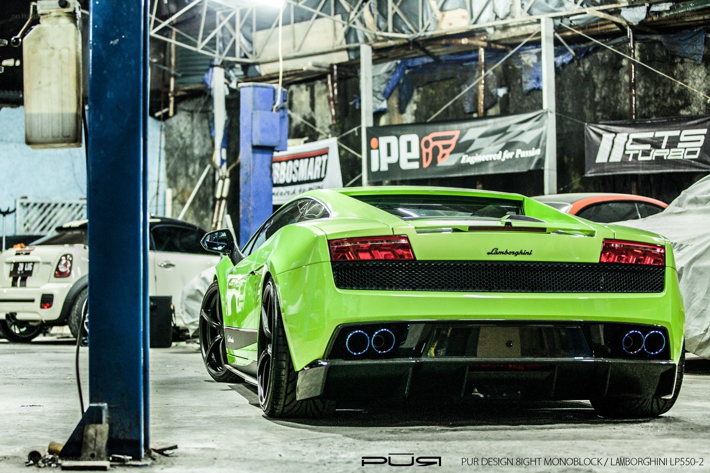 Green Lamborghini in garage
